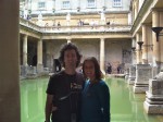 Craig and Linda at the Roman Baths in Bath, England. Copyright IndieTravelPodcast.com