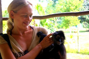 Dani & Spider Monkey in Belize. Copyright GlobetrotterGirls.com