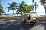 Jess driving a golf cart on Isla Mujeres, Mexico. Copyright GlobetrotterGirls.com