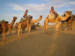 RIding camels in Egypt. Copyright Emma and Fabien Tronche